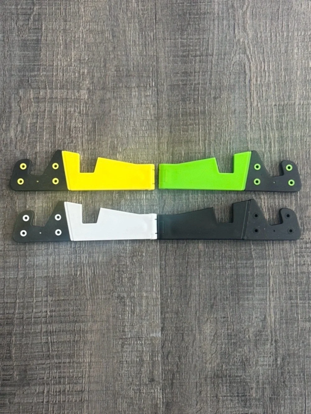 New Pack of 4 Universal Folding Phone Stands in Black, White, Yellow, & Green